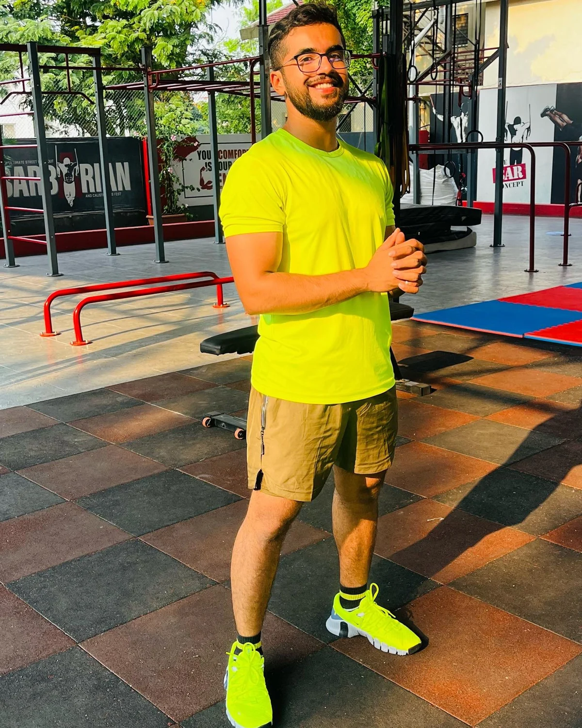 Abdeali smiling at the outdoor training area